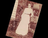 Historic photograph of a woman in front of a quilt In upcoming book by Schiffer Publishing,  Atglen, Pennsylvania; late 2012 Collection of Janet E. Finley