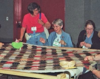 Women quilting Photo by Kim Coffman Quilts, Inc. and International Quilt Festival Houston, Texas www.quilts.com