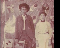 Historic photograph of a couple in front of a quilt In upcoming book by Janet E. Finley Schiffer Publishing, Atglen, Pennsylvania; late 2012 Collection of Janet E. Finley